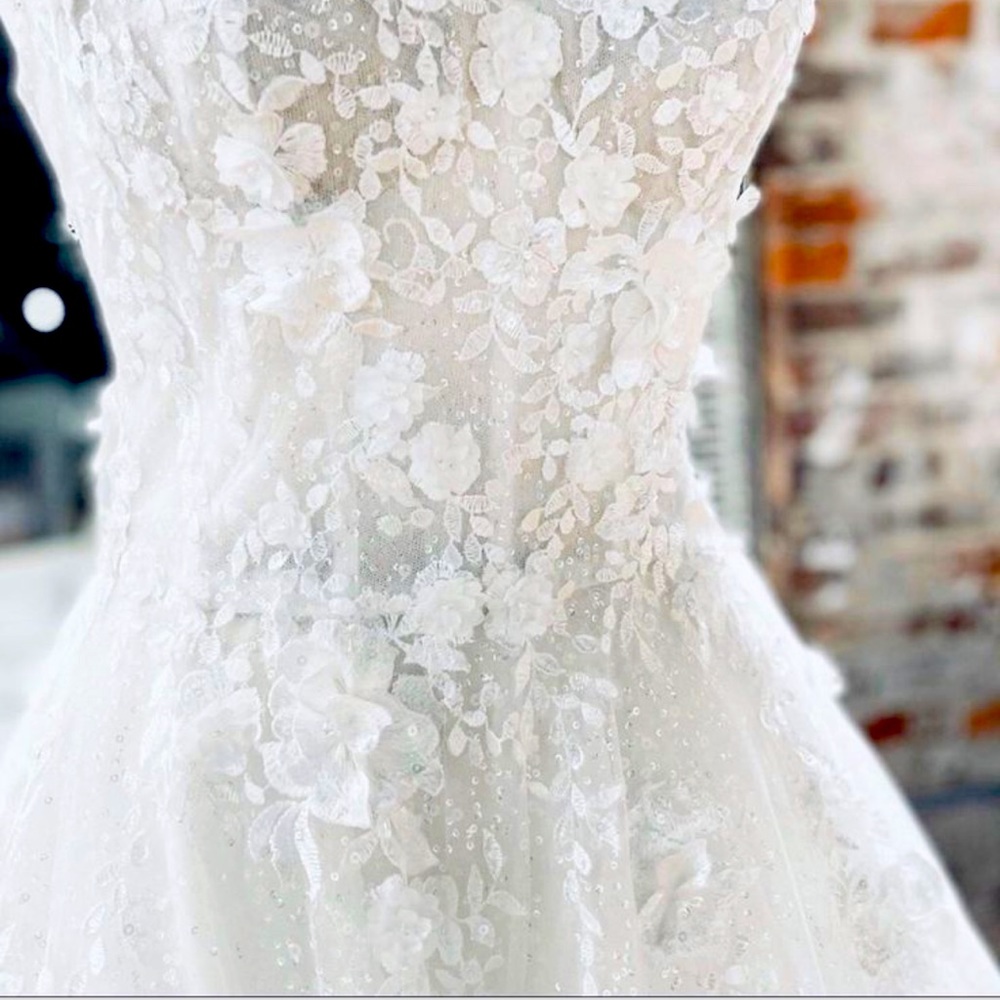 Selling a Rita Vinieris “Karter” wedding dress.